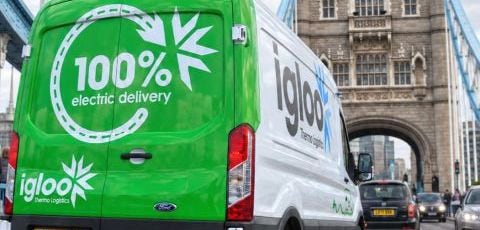 An Igloo van with "100% electric delivery" on its back doors, crossing Tower Bridge