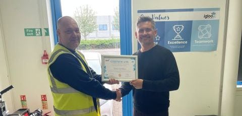 Adam Szlitkus receiving his 10 Year Long Service Award certificate from CEO Alistair Turner
